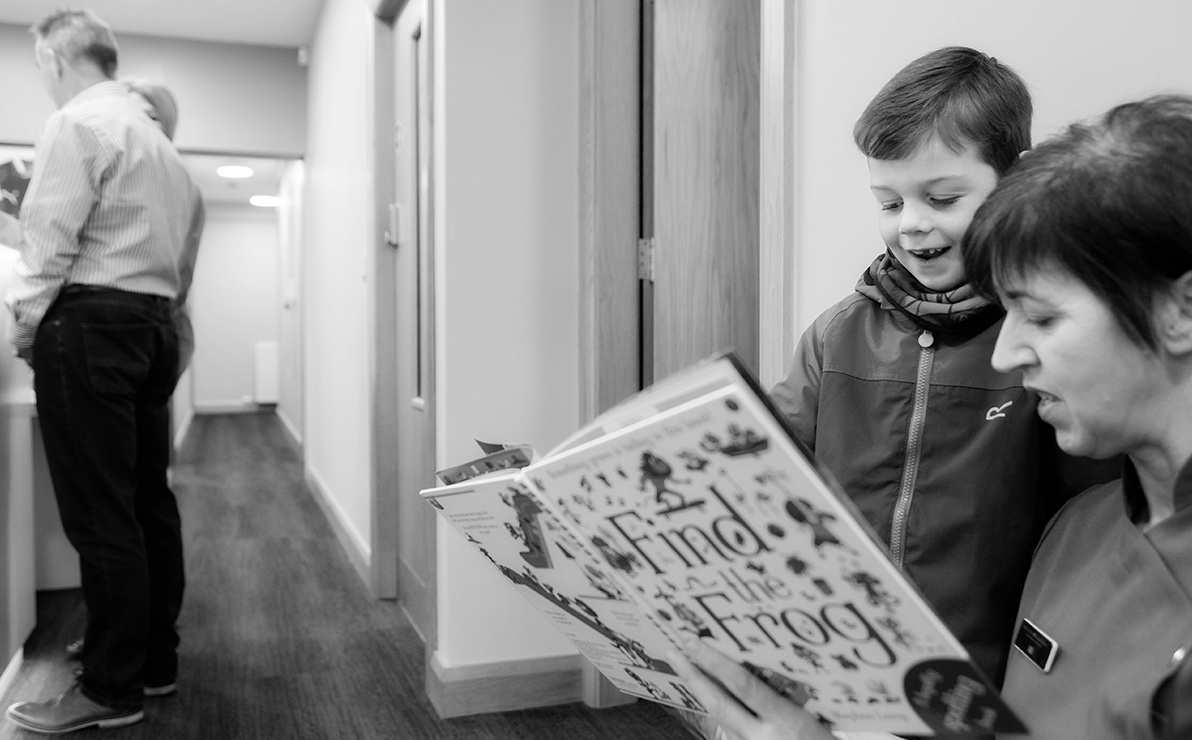 Woman and child reading in waiting room